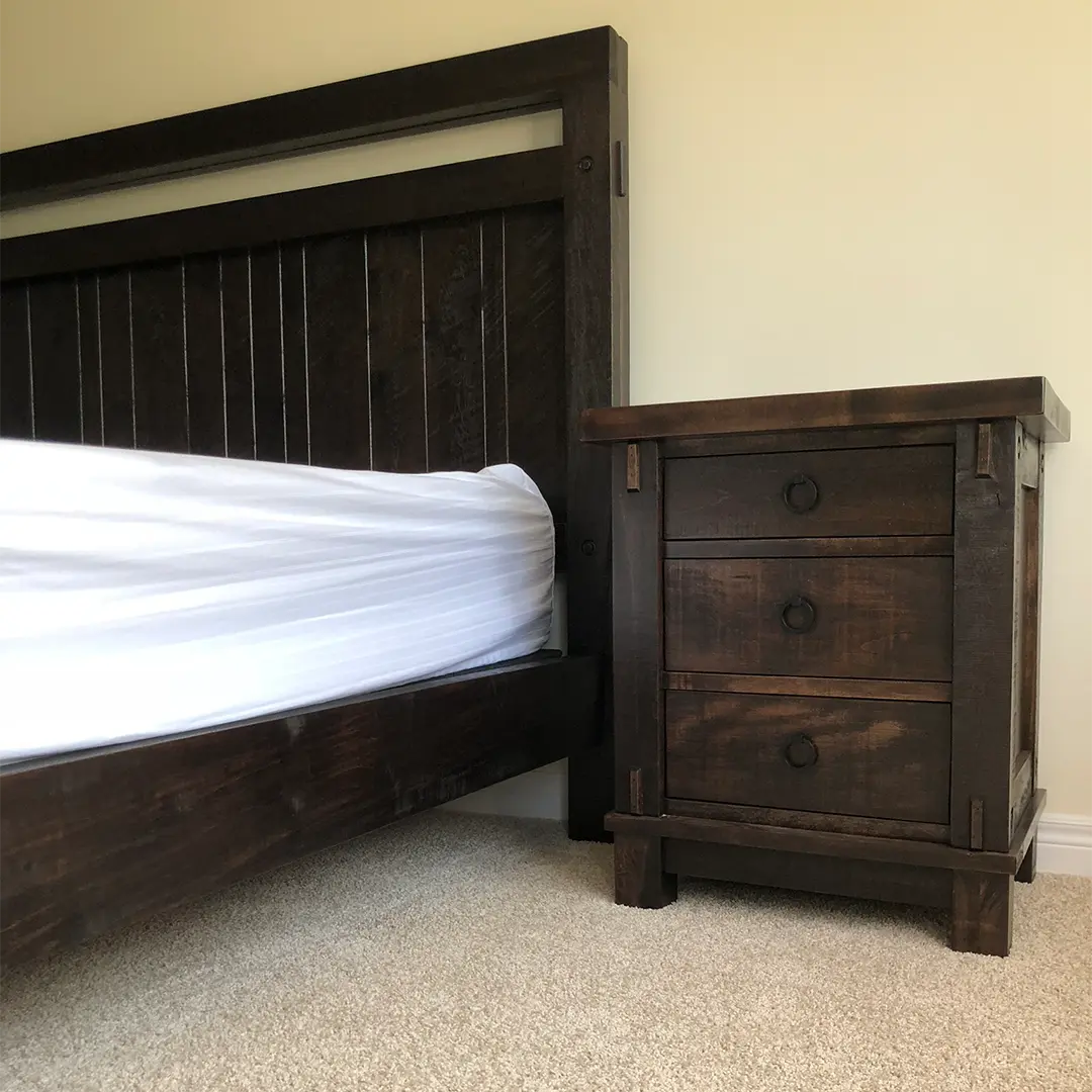 Timber solid wood bed and matching nightstand in a completed bedroom