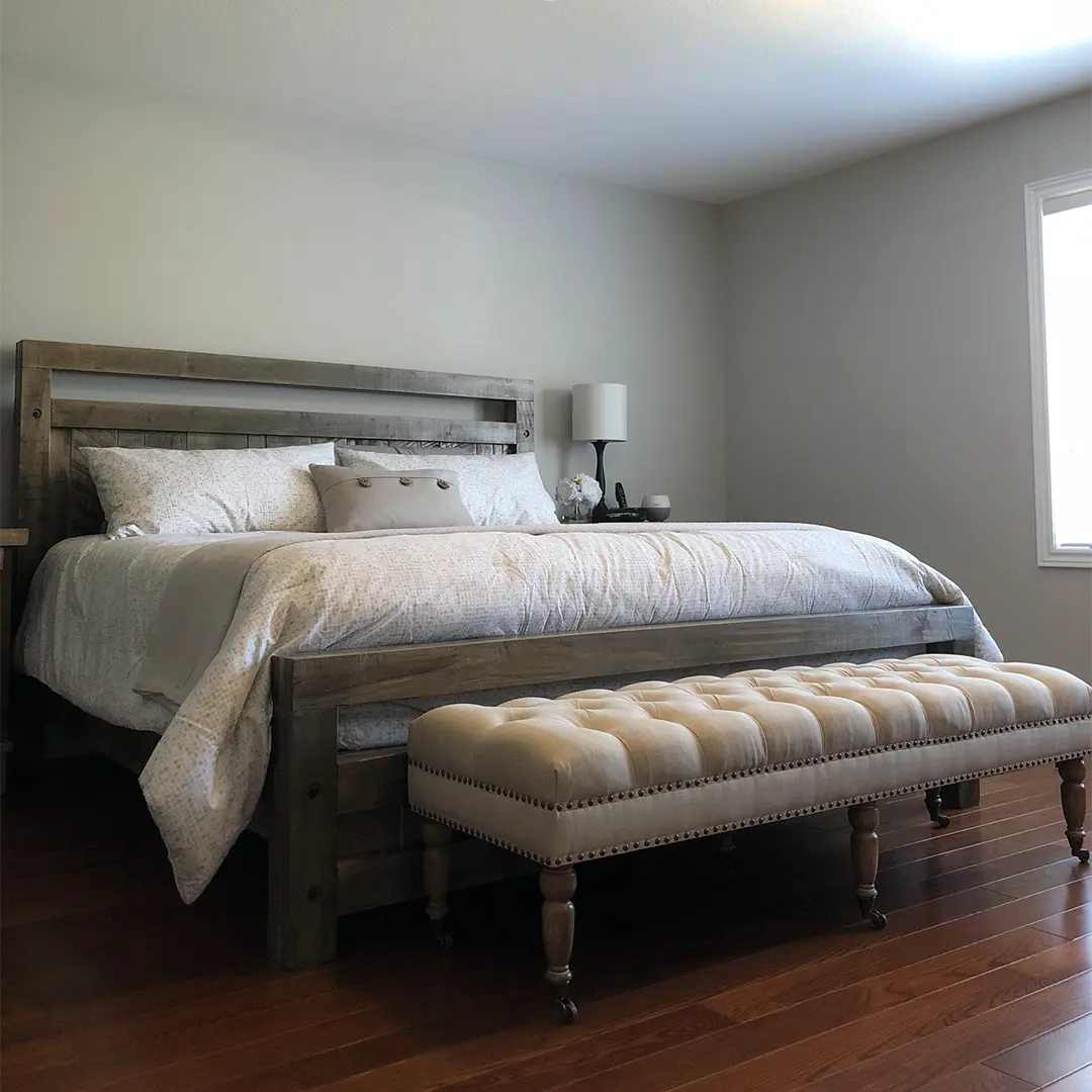 Timber solid wood bed frame installed in a naturally lit bedroom