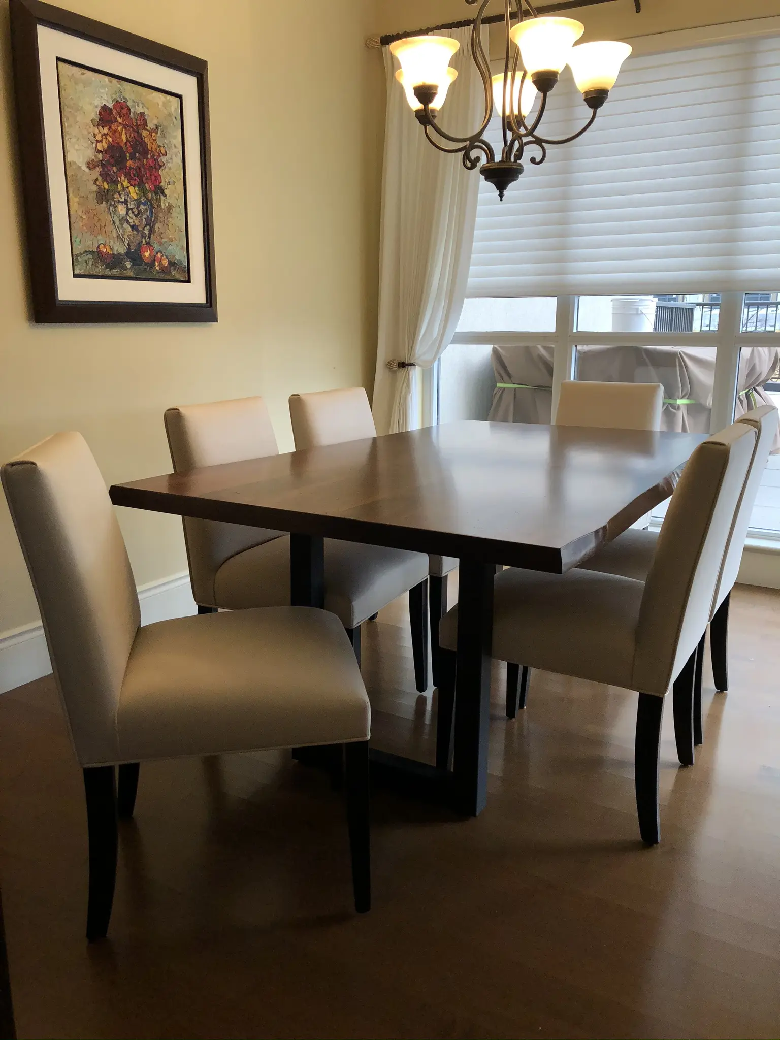 Custom round pedestal dining table with four upholstered chairs