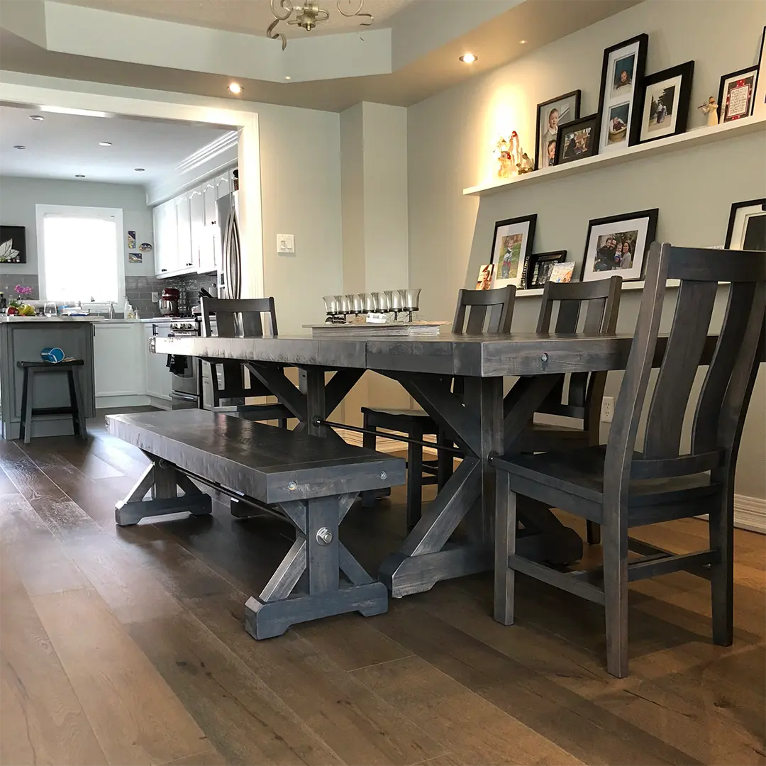 Klondike solid wood dining table and matching chairs in a contemporary home