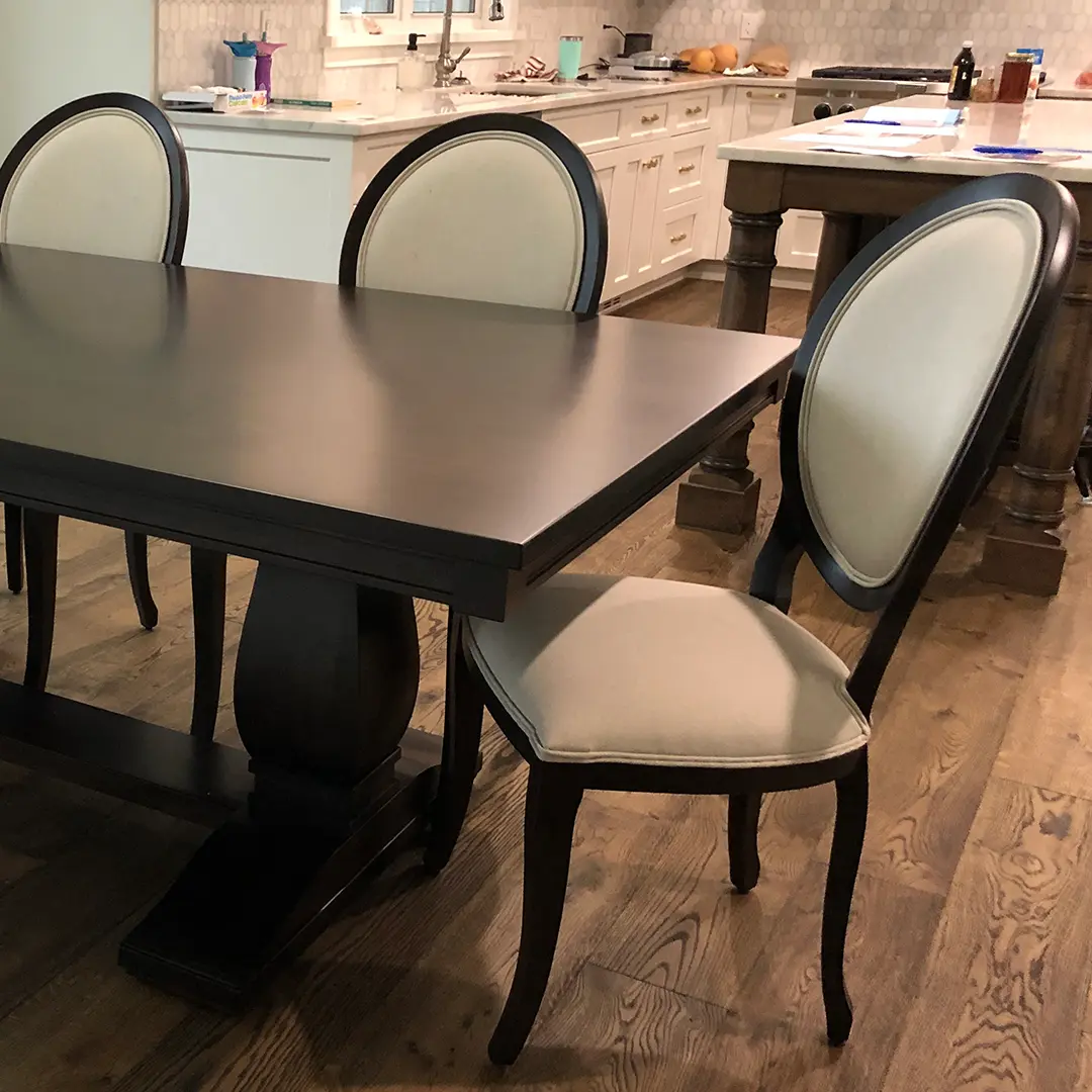 Madrid solid wood dining table paired with upholstered Ovalback chairs